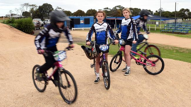 The Geelong BMX Club is asking council to build a changeroom and toilets. Drew Holloran and Stevie Holloran (standing) and Lacey Whyte and Jackson Taylor riding.