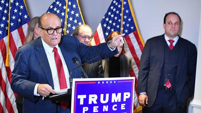 As the personal lawyer of then US president Donald Trump, Rudy Giuliani speaks at a press conference watched by Trump campaign adviser Boris Epshteyn, right, at the Republican National Committee headquarters in Washington, Picture: AFP