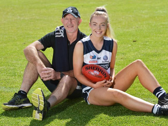 Former South Adelaide player Andrew Brockhurst and his daughter Emily, Saturday, March 9, 2019. South Adelaide had its first daughter of a past player make her debut in the SANFLW last week. (AAP Image/Brenton Edwards)