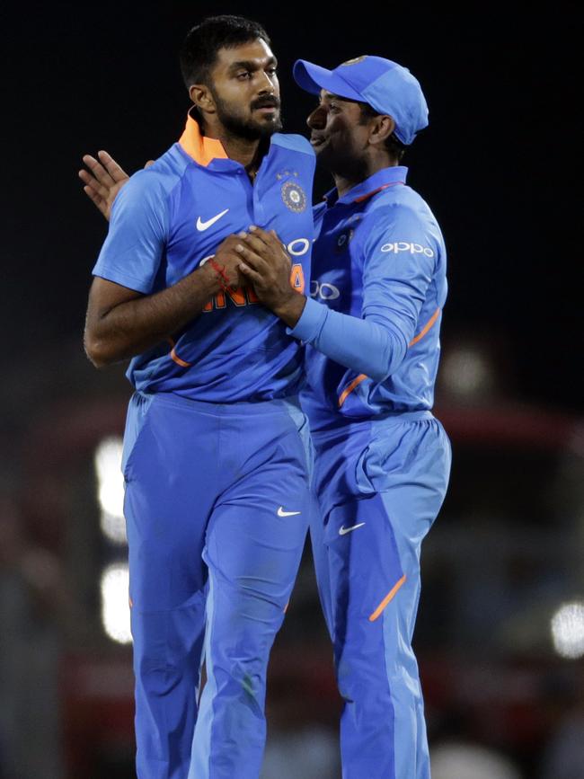 India's Vijay Shankar, left and Ambati Rayudu celebrate after winning the second one-day international cricket match against Australia in Nagpur, India.