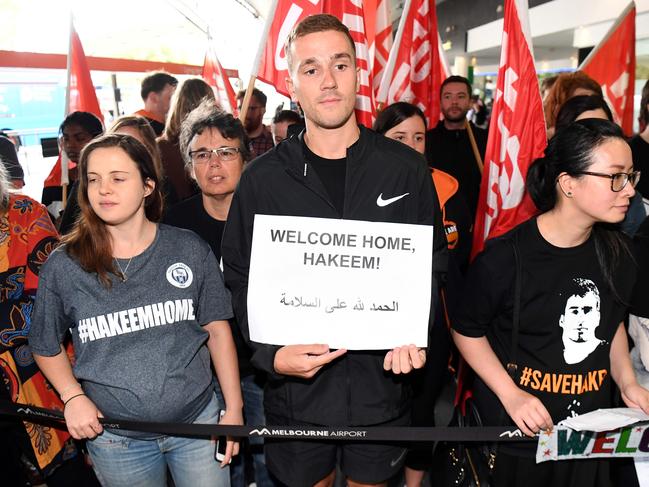 Supporters of refugee footballer Hakeem al-Araibi wait for his arrival at the airport in Melbourne. Picture: AFP