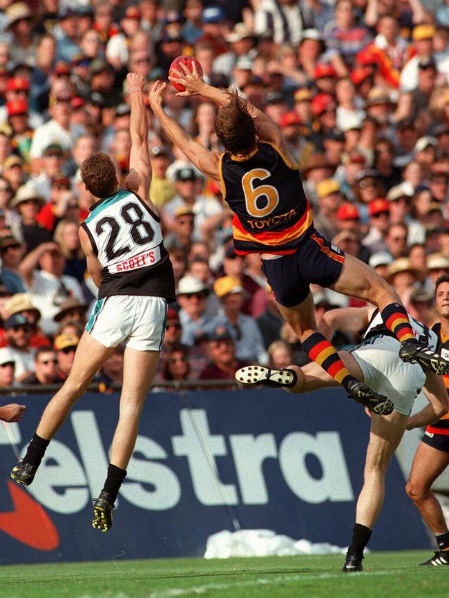 Modra goes again as Port’s Stephen Daniels attempts to defend.