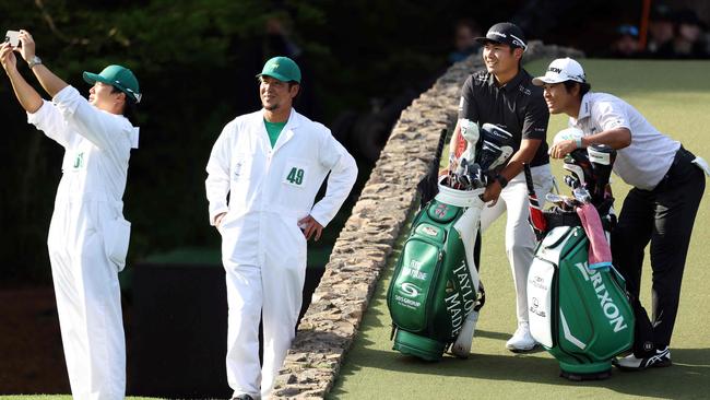 Japanese duo Ryo Hisatsune and former champion Hideki Matsuyama pose for a photo on the 12th hole Picture: Getty Images