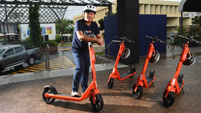 Neuron Mobility chief executive Zachary Wang with some of his company’s E-scooters which are being trialled on the streets of Darwin. Picture: Che Chorley.