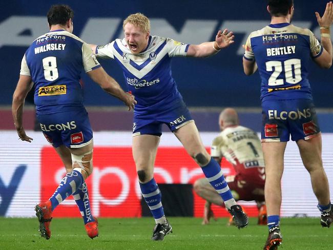 The NRL are in informal discussions about purchasing a large stake in England’s Super League. Former St George Illawarra and Canterbury prop James Graham celebrating St Helens’ 2020 Super League premiership. Photo: Martin Rickett/PA Images via Getty Images.