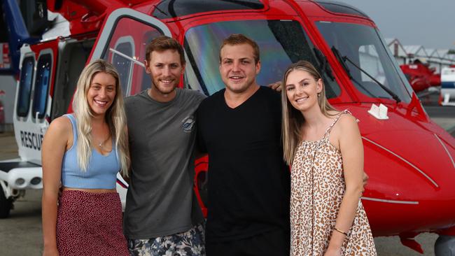 Craig Simpson is lucky to be alive after falling from Emerald Creek Falls on March 6 in 2021, suffering a fractured spine, broken ribs and life threatening head injuries. His friends kept Craig alive until the QGAir rescue helicopter arrived and saved his life. On Friday, Olivia McDonald, Dylan Lazzaroni, Craig Simpson and Ashlie Majewski got to thank the rescue aircrew that saved Craig's life at the QGAir hangar at Cairns Airport. Picture: Brendan Radke