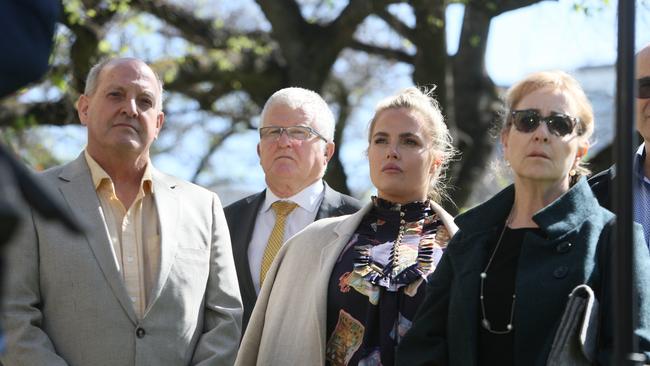 Detective Superintendent Des Bray stands (second left) with Genevieve Wallis, daughter of NCA bombing victim Peter Wallis, and supporters. Picture NCA NewsWire / Emma Brasier