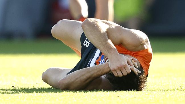 Giants Stephen Coniglio injured in tackle by St Kilda's Mitch Owens during the AFL match between the GWS Giants and St.Kilda Saints at Manuka Oval, Canberra on April 12, 2024. Photo by Phil Hillyard(Image Supplied for Editorial Use only - **NO ON SALES** - Â©Phil Hillyard )