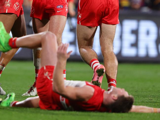 ADELAIDE, AUSTRALIA - JUNE 15: Joel Amartey of the Swans celebrates a goal with team mates including Hayden McLean while Taylor Adams of the Swans gets pushed by Mitchell Hinge of the Crows and gets a free kick infront of goal during the 2024 AFL Round 14 match between the Adelaide Crows and the Sydney Swans at Adelaide Oval on June 15, 2024 in Adelaide, Australia. (Photo by Sarah Reed/AFL Photos via Getty Images)