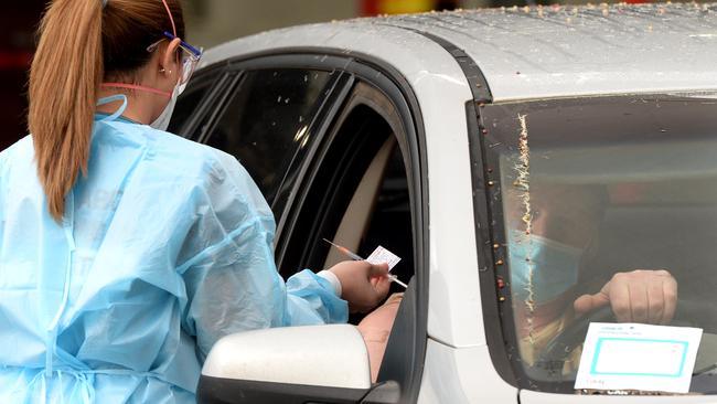 A nurse administers the jab at the former Bunnings store. Picture: Andrew Henshaw