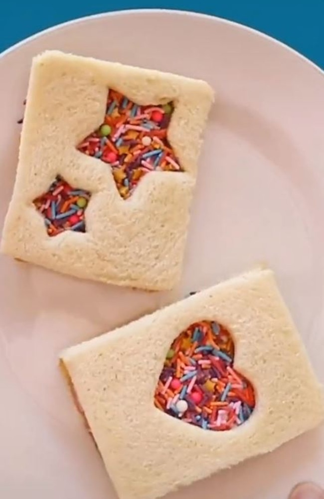 It doesn’t end there – he doesn’t cut it up in triangles. Instead, he uses a cookie cutter to form love heart and star shaped cut-outs in another change to the original – a sandwich lid. Picture: TikTok/Lunchboxdad