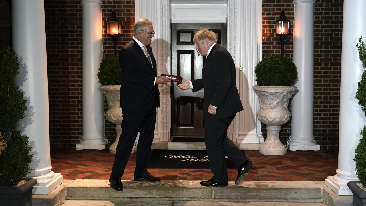 Prime Minister Scott Morrison greets UK Prime Minister Boris Johnson to a working dinner in Washington on September 21, 2021. Picture: Adam Taylor