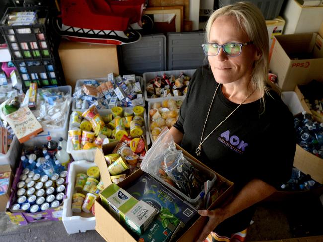 Sarah Morris in her garage at Warriewood, in December 2020, full of food taken from hotel quarantine rooms which was then distributed throughout homeless shelters. Picture: Jeremy Piper