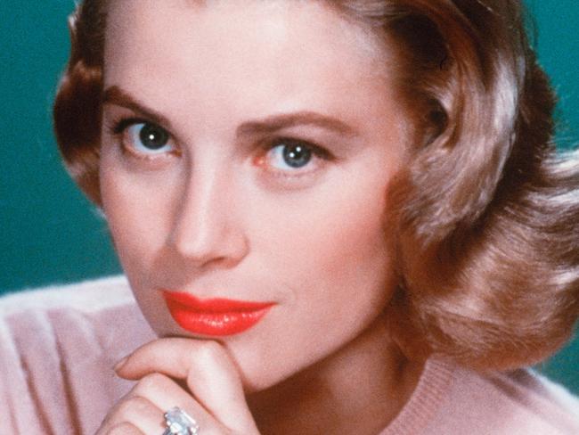 Grace Kelly wearing the diamond engagement ring from Prince Rainer II of Monaco.