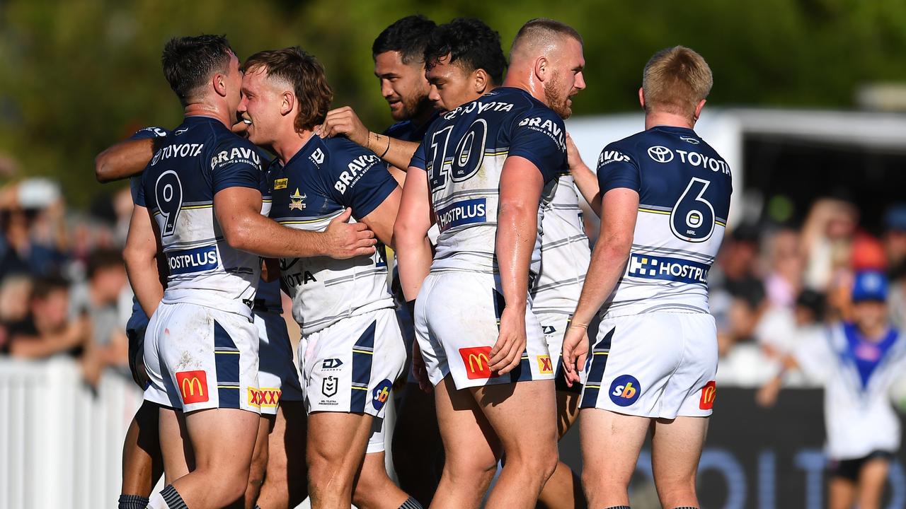 BUNDABERG, AUSTRALIA - AUGUST 07: Scott Drinkwater of the Cowboys celebrates with team mates after scoring a try during the round 21 NRL match between the Canterbury Bulldogs and the North Queensland Cowboys at Salter Oval, on August 07, 2022, in Bundaberg, Australia. (Photo by Albert Perez/Getty Images)