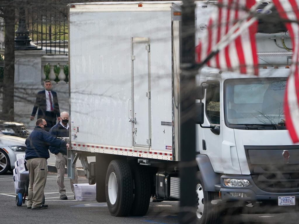 Boxes are loaded onto a truck on West Executive Avenue at the White House ahead of the Trumps’ planned early exit on Wednesday. Picture: Mandel Ngan / AFP