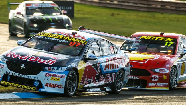 Shane van Gisbergen in his Red Bull Holden gains the upper hand early against pole sitter Will Davison, a move which would prove decisive. Picture: Daniel Kalisz/Getty Images