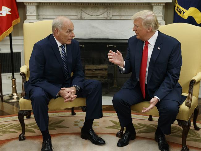 President Donald Trump talks with new White House Chief of Staff John Kelly after he was privately sworn in during a ceremony in the Oval Office yesterday. Picture: Evan Vucci/AP