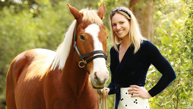 Emily Seebohm with her horse Platinum. The world champion swimmer has been riding since she was 16 when she used to watch the Saddle Club. Picture: Claudia Baxter.