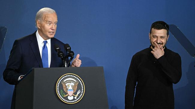 US President Joe Biden speaks alongside Ukraine's President Volodymyr Zelensky (R) during the Ukraine Compact initiative on the sidelines of the NATO Summit.