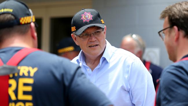 Prime Minister Scott Morrison meets firefighters. Picture: AAP Image/Kelly Barnes