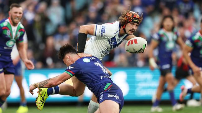 SYDNEY, AUSTRALIA - JULY 06: Josh Curran of the Bulldogs is tackled during the round 18 NRL match between Canterbury Bulldogs and New Zealand Warriors at Accor Stadium, on July 06, 2024, in Sydney, Australia. (Photo by Matt King/Getty Images)