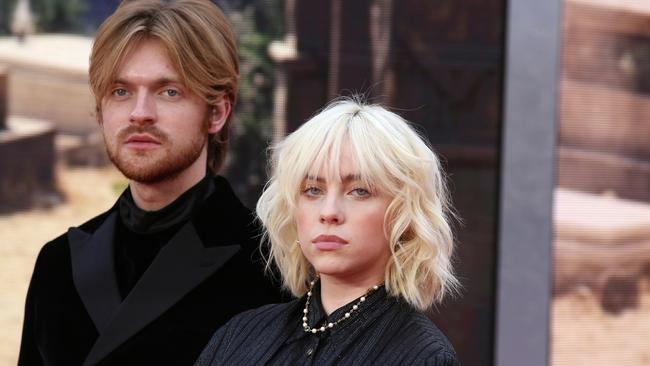 Billie Eilish with her brother Finneas O'Connell at the No Time To Die world premiere at Royal Albert Hall in London last year. Picture: Getty