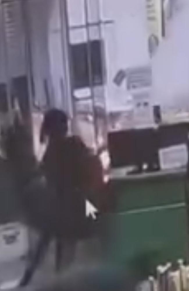 The moment a fire extinguisher was fired into a service station worker's space at a Katherine BP station. Picture: Supplied