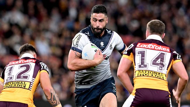BRISBANE, AUSTRALIA - AUGUST 19: Jesse Bromwich of the Storm takes on the defence during the round 23 NRL match between the Brisbane Broncos and the Melbourne Storm at Suncorp Stadium, on August 19, 2022, in Brisbane, Australia. (Photo by Bradley Kanaris/Getty Images)
