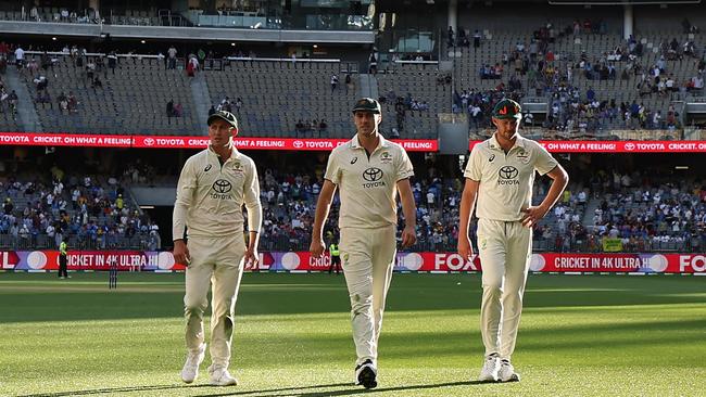 PERTH, AUSTRALIA - NOVEMBER 23: Marnus Labuschagne, Pat Cummins and Josh Hazlewood of Australia walk off the field at the end of play on day two of the First Test match in the series between Australia and India at Perth Stadium on November 23, 2024 in Perth, Australia. (Photo by Robert Cianflone/Getty Images)