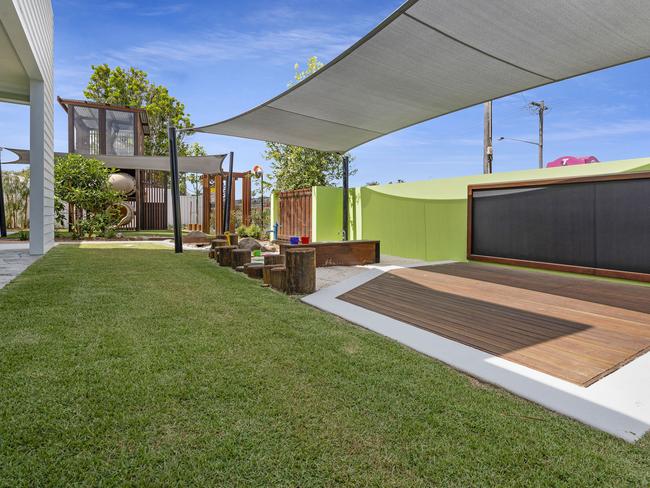 The outdoor area at Grow Early Education offers plenty of engagaing spaces and fun activities, from the mud kitchen and water pump to the large fort and slide.