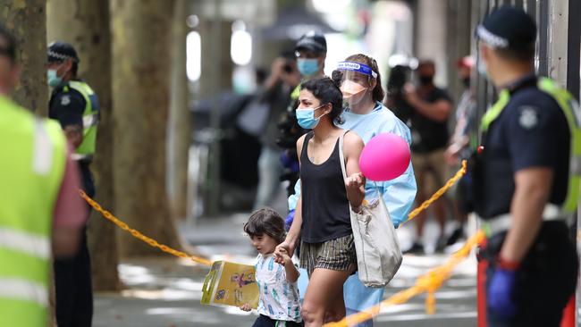 The Holiday inn on Flinders Lane which was previously operating as a COVID quarantine hotel being evacuated in February Picture: David Crosling