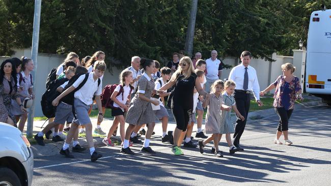 Federal MP Kevin Andrews with school kids crossing the busy Williamsons Rd. Picture: Stuart Milligan