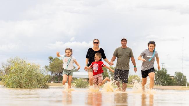 A family enjoy the water at Thomson River. Picture: Aaron Skinn