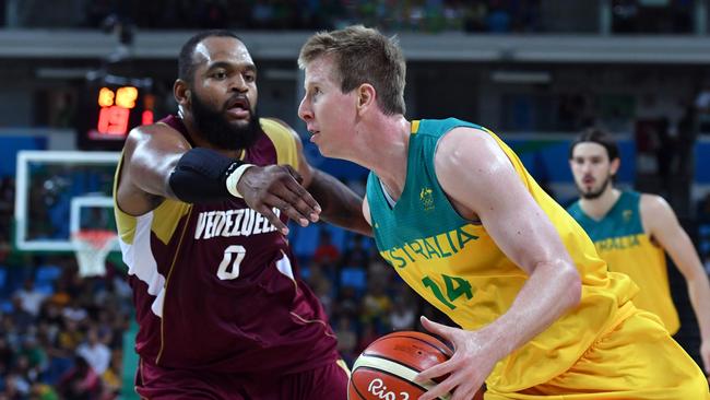 Australia's power forward Brock Motum (R) works around Venezuela's centre Gregory Echenique during a Men's round Group A basketball match between Australia and Venezuela at the Carioca Arena 1 in Rio de Janeiro on August 14, 2016 during the Rio 2016 Olympic Games. / AFP PHOTO / Andrej ISAKOVIC