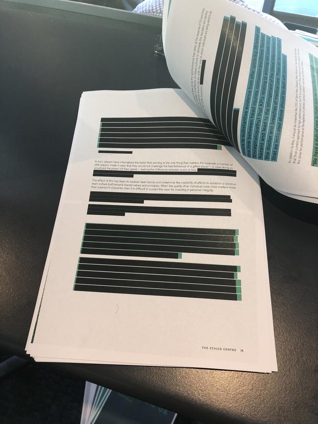 A section of the heavily redacted report.