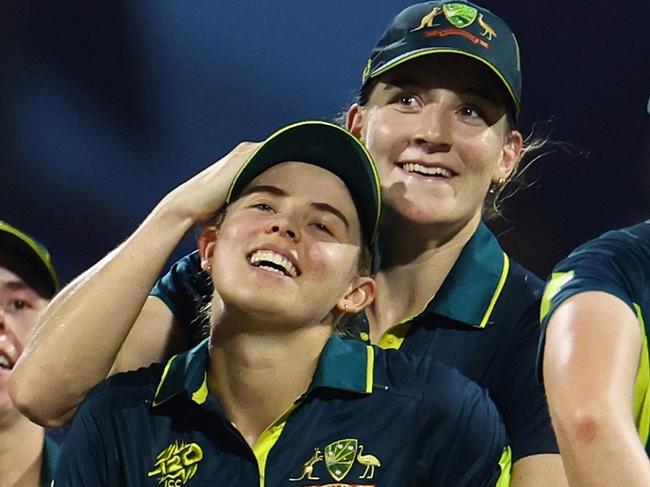 SHARJAH, UNITED ARAB EMIRATES - OCTOBER 13: Phoebe Litchfield of Australia celebrates with team mates after running out Rch during the ICC Women's T20 World Cup 2024 match between India and Australia at Sharjah Cricket Stadium on October 13, 2024 in Sharjah, United Arab Emirates.  (Photo by Francois Nel/Getty Images)