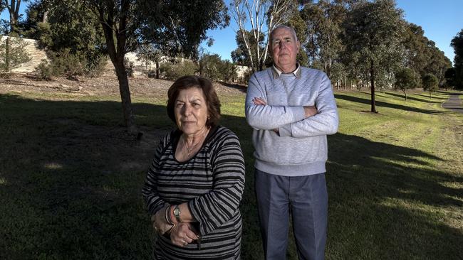 Estelle St homeowners John Smith and Vicki Kermanidis fear losing their local park to the North East Link project. Picture: Luis Enrique Ascui