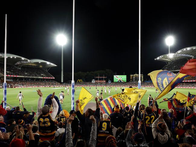 Adelaide fans celebrate a goal during the AFL Gather Round match between the Adelaide Crows and Carlton Blues at the Adelaide Oval on April 13, 2023. Photo by Phil Hillyard(Image Supplied for Editorial Use only - **NO ON SALES** - Â©Phil Hillyard )