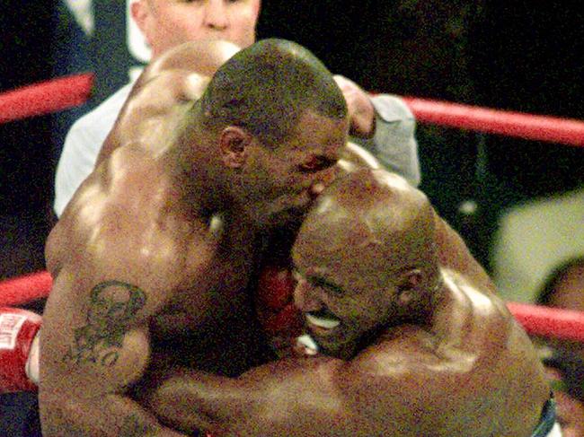 Tyson (left) infamously bites the ear of Evander Holyfield during WBA Heavyweight match in Las Vegas, 1997. Picture: Supplied