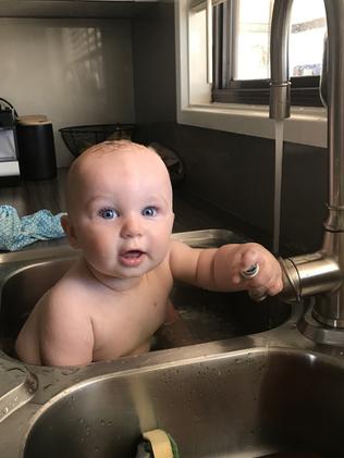 Seven-month-old Max Headland keeps cool in Roxby Downs. Picture: Millie Thomas