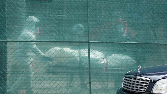 A body is removed from a refrigeration truck serving as a temporary morgue at the Brooklyn Hospital Center, in the Borough of Brooklyn in New York. Picture: Bryan R. Smith/AFP)