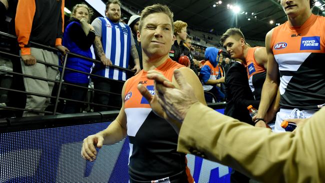 Toby Greene celebrates a Giants win with fans.