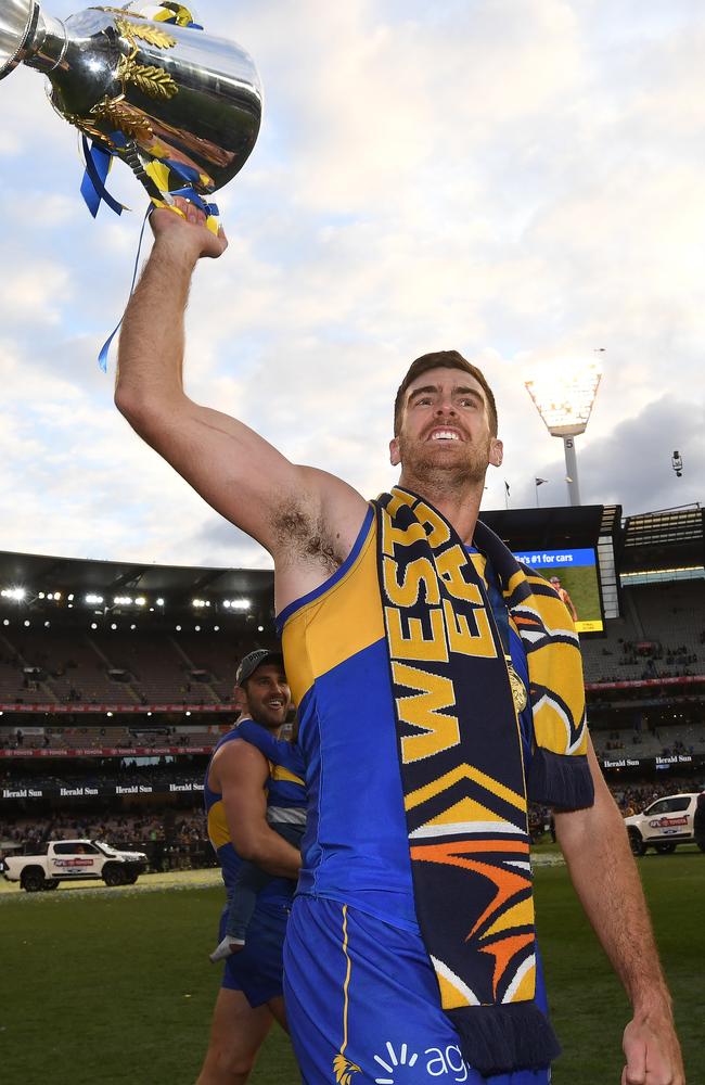 Scott Lycett with the Eagles’ premiership cup. His manager says reports he is reconsidering a move to Port Adelaide as ‘complete rubbish’. AAP Image/Julian Smith