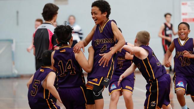 Winners are grinners in basketball. Picture: Geoff Tripp