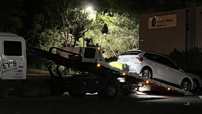 A white SUV involved in the incident was towed from the scene after the Gold Coast shooting. Police also seized a second vehicle found in the carpark, but officers did not believe it was related to the shooting incident. Picture: Keith Woods