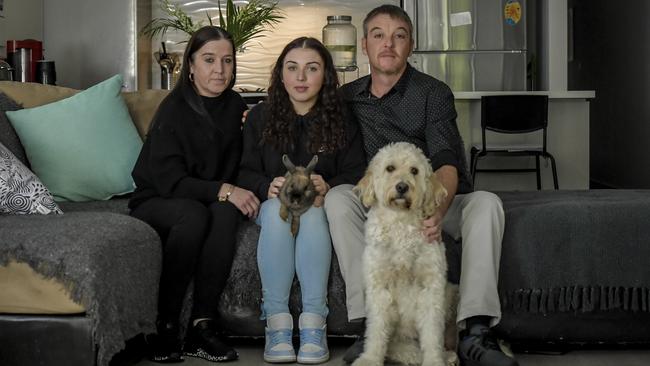 Kelly, left, Rebecca and Mark Green with dog Maisie and rabbit Marmaduke at their Adelaide home. Picture: Roy VanDerVegt