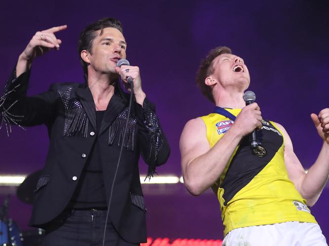 The 2017 AFL Grand Final between the Adelaide Crows and Richmond Tigers at the Melbourne Cricket Ground. The Killers lead singer Brandon Flowers with Jack Riewoldt.    Picture: Alex Coppel.