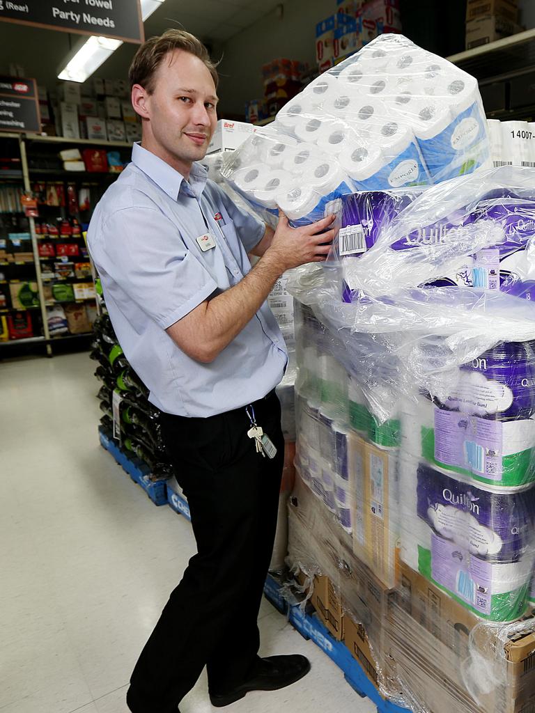 Assistant Manager of IGA Pease Street Daniel Oliver unpacks a pallet loads of toilet paper. Picture: Stewart McLean