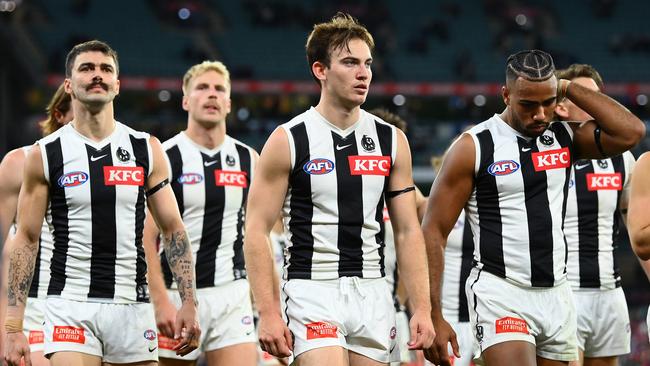 The Magpies walk from the field after the loss. Picture: Getty Images